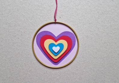 Heart catcher with paper hearts in the middle