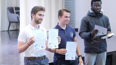 3 students pose with their diplomas