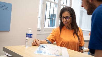 Ourida Manseri, a young researcher in linguistics, explains her research on the Berber language to a visitor to the European Heritage Days.