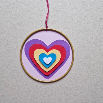 Heart catcher with paper hearts in the middle