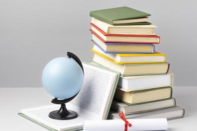 front-view-stacked-books-diploma-earth-globe-with-copy-space-education-day.png
