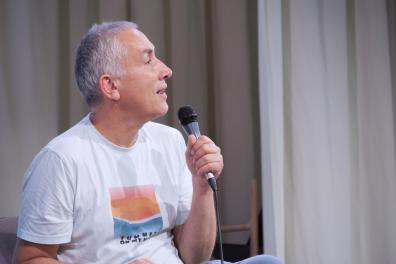 A man speaks into a microphone