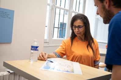 Ourida Manseri, a young researcher in linguistics, explains her research on the Berber language to a visitor to the European Heritage Days.