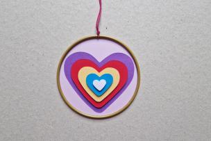 Heart catcher with paper hearts in the middle