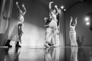 Students dance on the auditorium stage